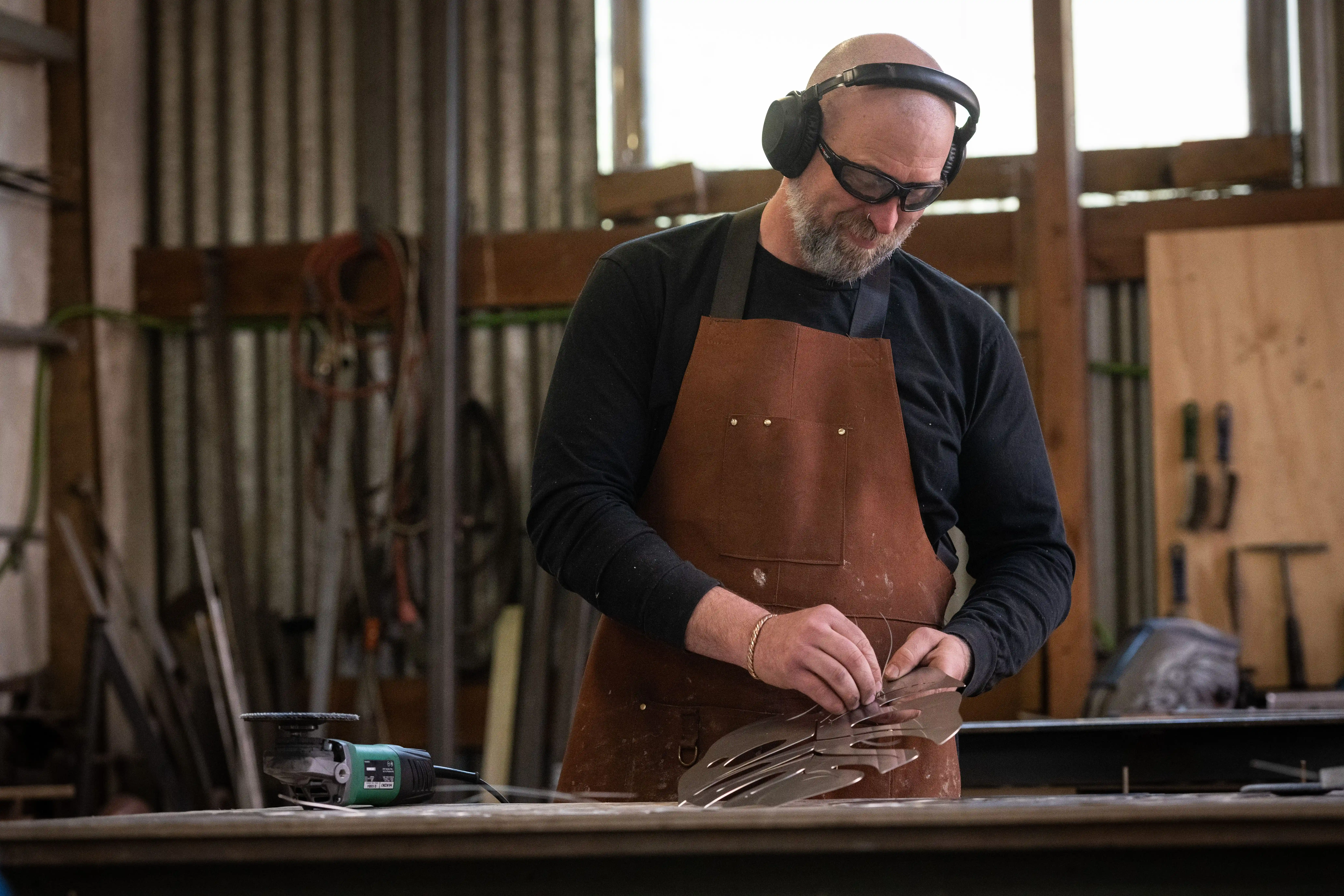 Shaping raw metal in the workshop